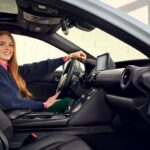 interior of the 2025 Lexus IS with female driver