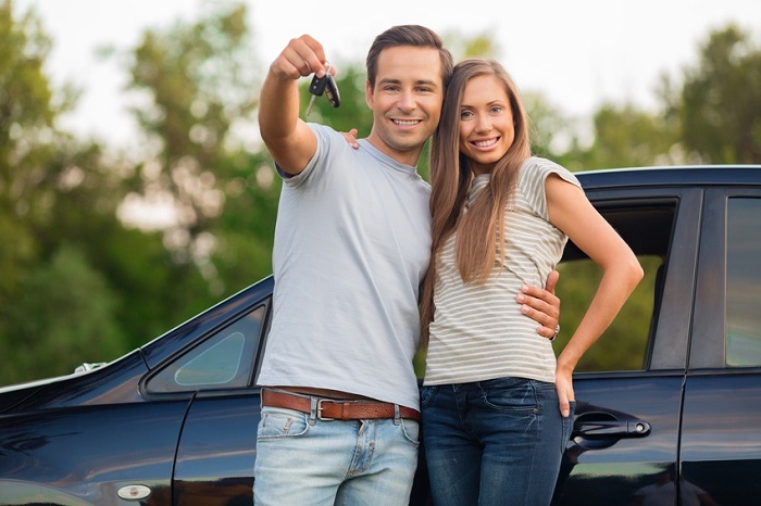 Couple with a car and car keys