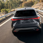 Rear end of a 2026 Lexus RX Hybrid SUV on the road